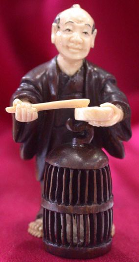 win4032 ebony wood mammoth ivory netsuke man feed bird